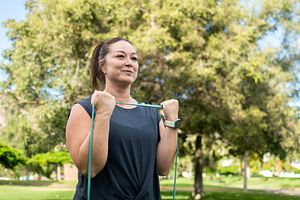 Woman Doing Resistance Band Bicep Curls, a Sports & Recreation Photo by etorres69