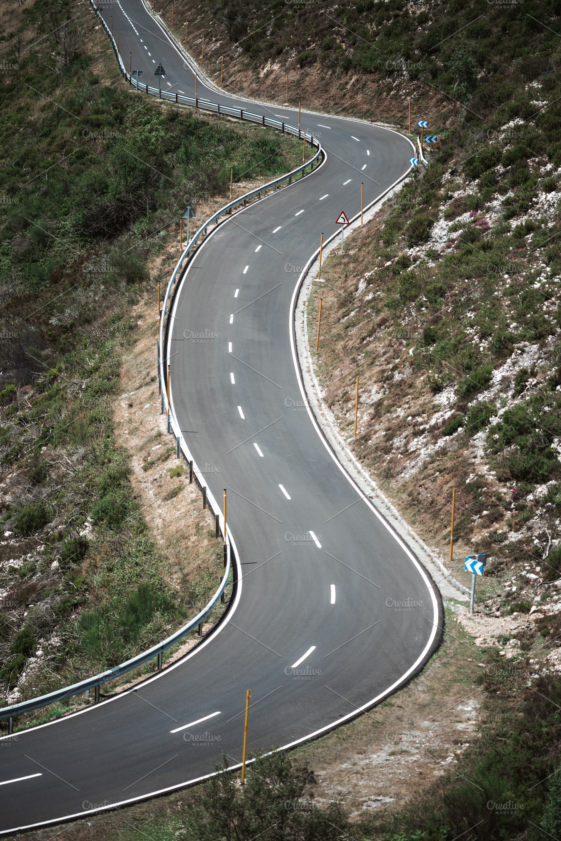 Curvy mountain road view, a Transportation Photo by SkyNext