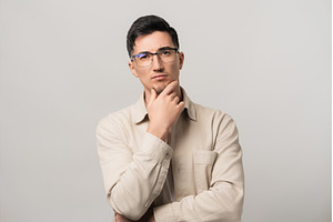 Deep in thought. A man in eyeglasses, a Person Photo by AD Stock Images