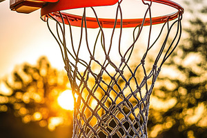 Sunset basketball hoop captures the essence of evening sports in high quality, a Sports & Recreation Photo by AlyaAnd
