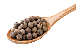 Allspice peas in a wooden spoon, a Food & Drink Photo by innakreativ