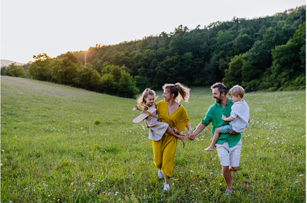 Happy young family spending time, a Person Photo by HalfPoint