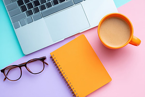 Creative workspace flat lay featuring laptop, notebook, glasses, and coffee in, a Business Photo by AlyaAnd