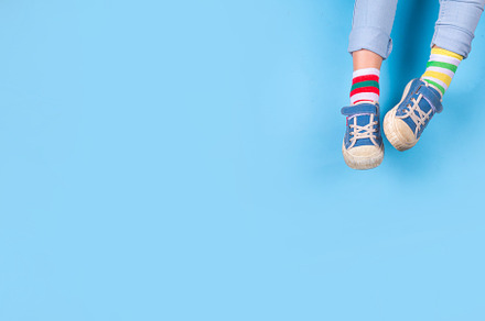 Child legs in mismatched socks, an Abstract Photo by Rimma