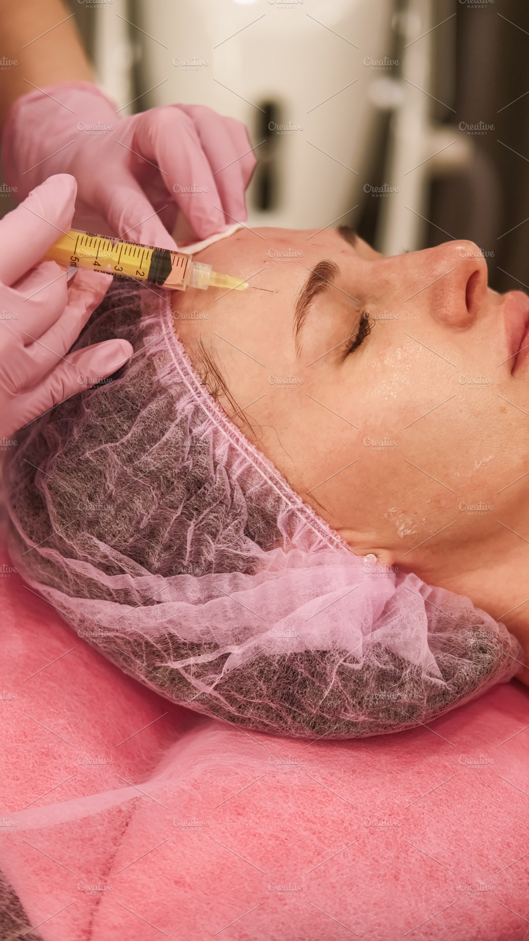 Dermal injection facial care woman hands filler, a Person Photo by Photo Drive Studio