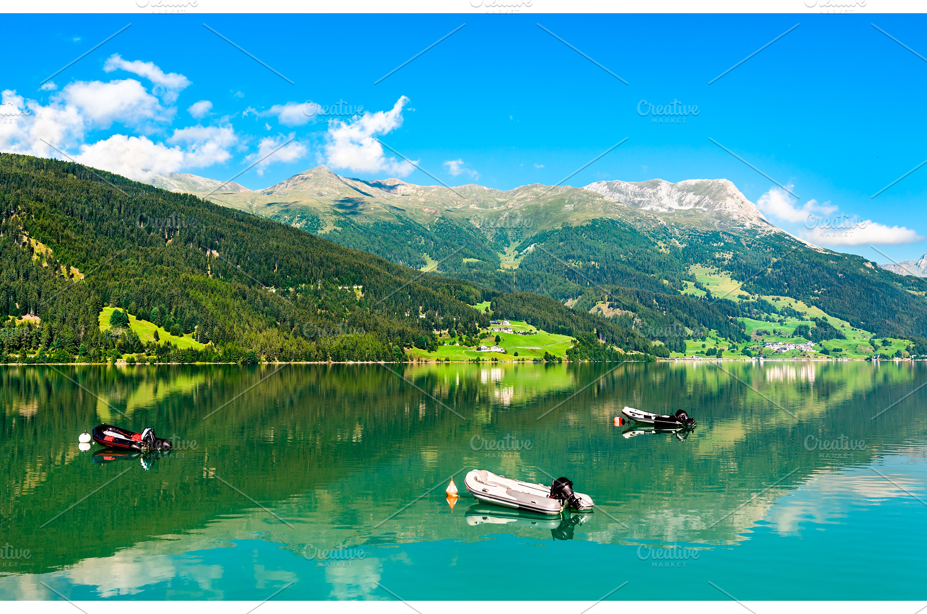 Boats on Reschensee, an artificial, a Nature Photo by Leonid Andronov