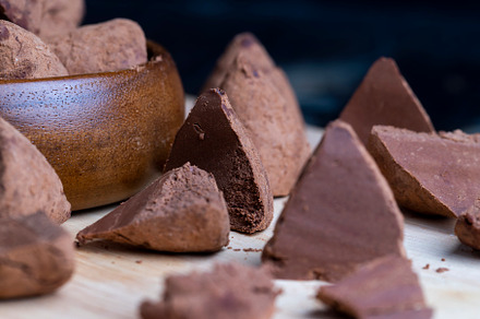 Cut into pieces truffle candy on a board, a Photo by MyPhotos