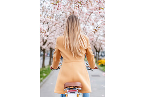 Young blonde woman cycles under, a Business Photo by Lermont51