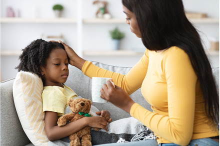 Caring Black Mother Giving Hot Tea, a Person Photo by Prostock-Studio