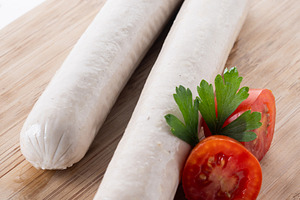 Raw Bratwurst sausages with cherry tomatoes and parsley, a Food & Drink Photo by etorres69