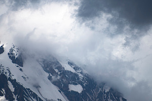 Snow covered mountain slope hidden in dense fog and storm cloud, a Photo by Pictures for you!!!!!!!!!