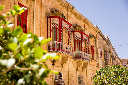 Balconies with worked structure in the center of Mdina (Malta), an Architecture Photo by Angelo D'Amico Photograph