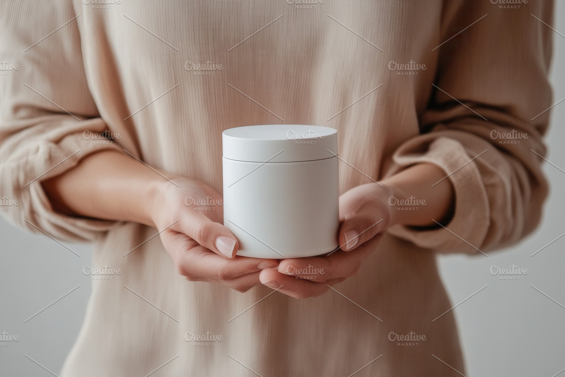 Person holding a white cosmetic jar, a Photo by Pavel_design