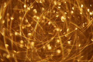 Sparkling garland defocused golden festive flicker, a Background Photo by Photo Drive Studio