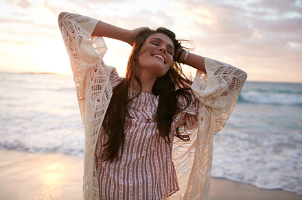 Smiling young woman containing adult, attractive, and beach, a Person Photo by Jacob Lund