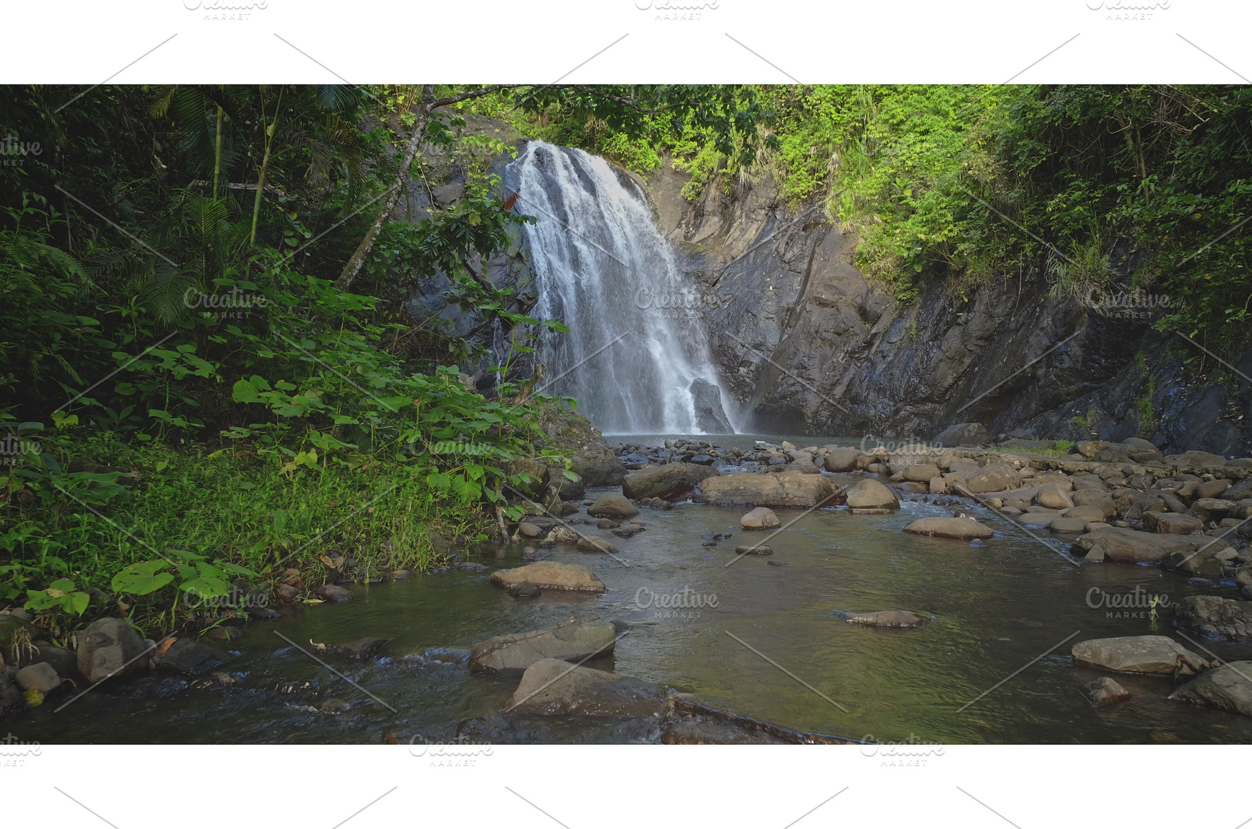 Tropical waterfall cascading into, a Nature Photo by Goinyk