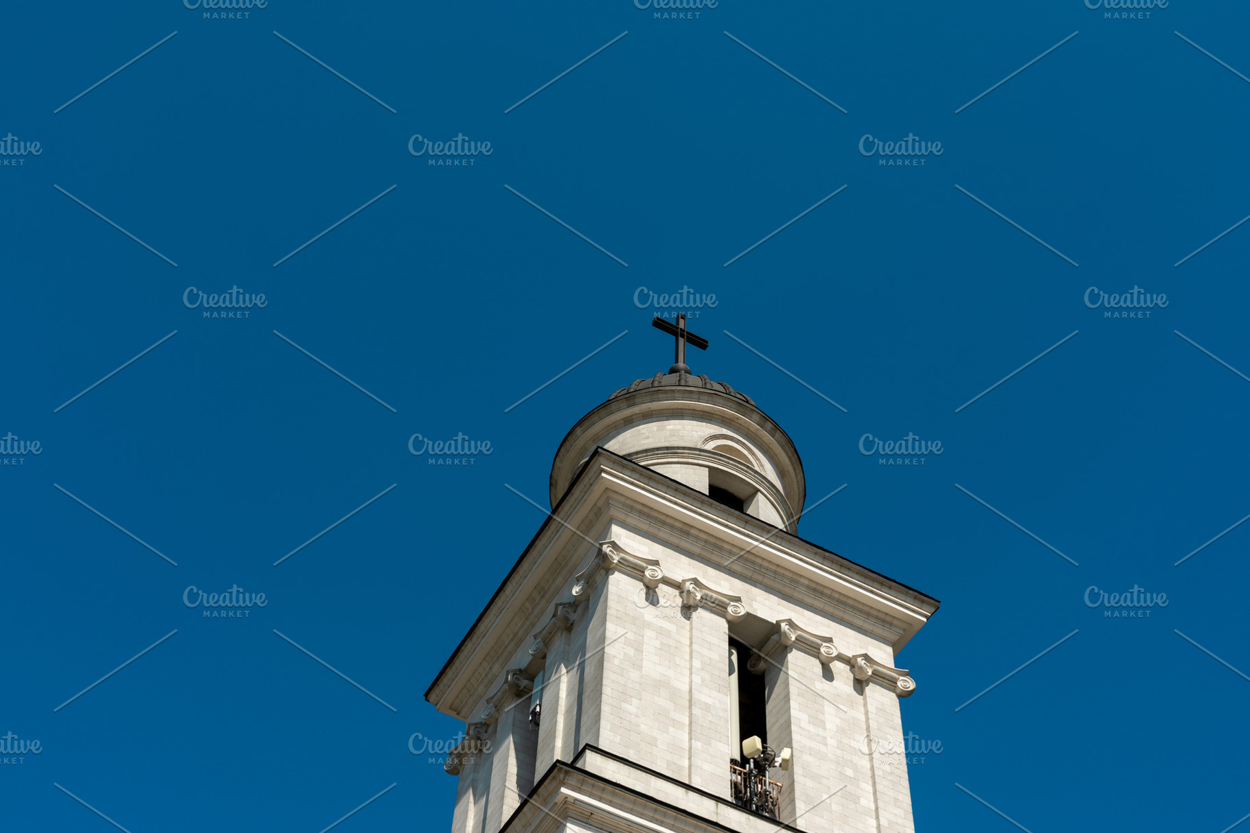 Historic church bell tower with cross, located in central Chisin, a Nature Photo by Ales Munt