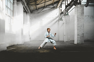 Female practicing karate containing karate, martial, and art