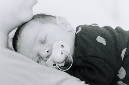 A newborn baby asleep on his mothers chest, a Person Photo by rubenchase