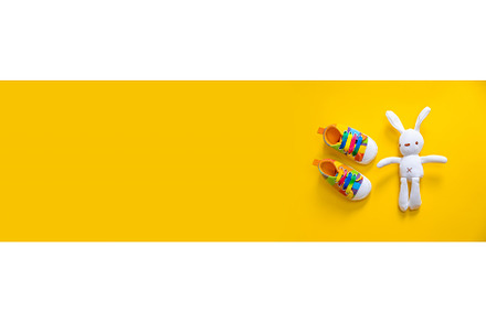 Shoes for newborns on a yellow
