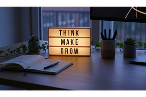 Minimalist desk setup at night shows, a School & Education Photo by Igor Tichonow