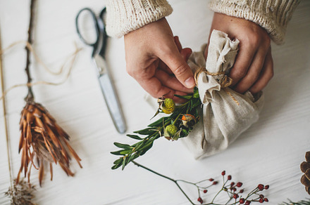 Decorating stylish christmas gift, a Holiday Photo by Sonjachni