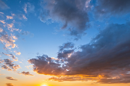 Clouds in evening dusk sky panoramic view. Climate, environment, a Nature Photo by YuriyB