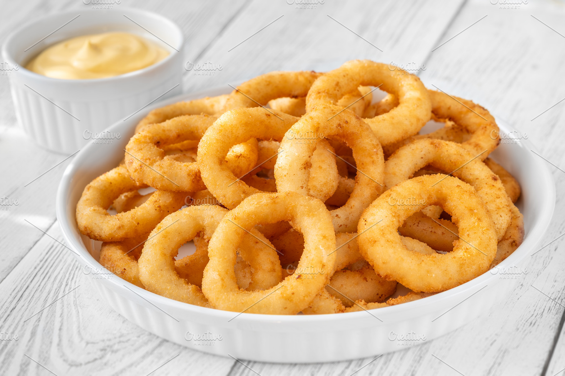 Crispy onion rings with cheese sauce, a Food & Drink Photo by Alexander Prokopenko