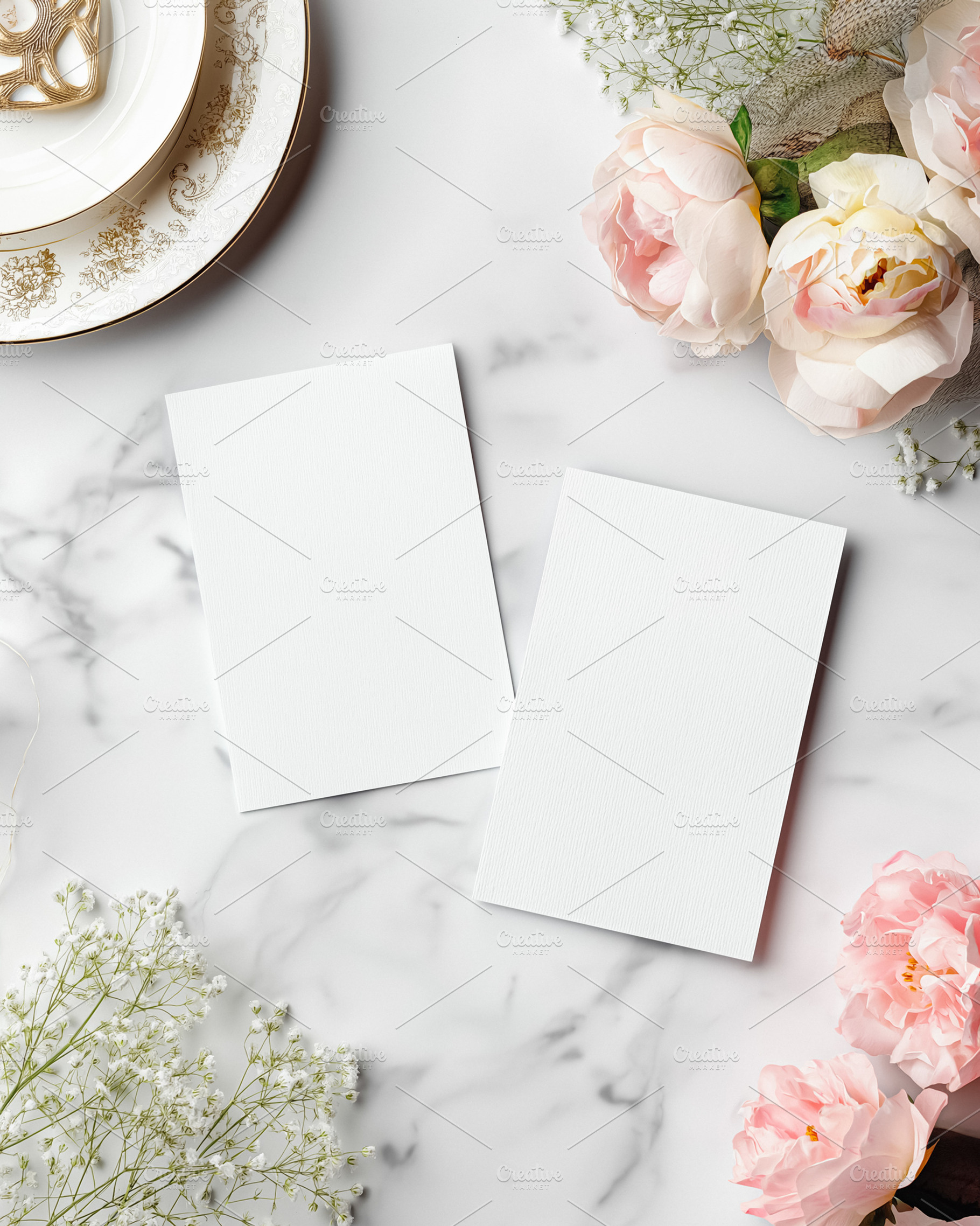 Two blank cards on marble desktop with pink roses, babies breath, and elegant d, a Holiday Photo by Studio ANNA