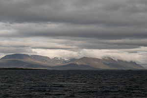 Majestic view of mountains and ocean near Akranes, Iceland under cloudy skies, a Photo by AS photostudio