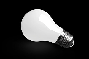 Light bulb glowing brightly on a bla, a Photo by Tanuart