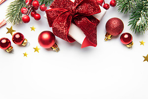 Christmas gift with red ornaments and pine branches, a Holiday Photo by Olena Rudo