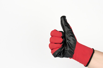 hand in a black-red work textile glove shows a gesture like it,, a Person Photo by ndanko