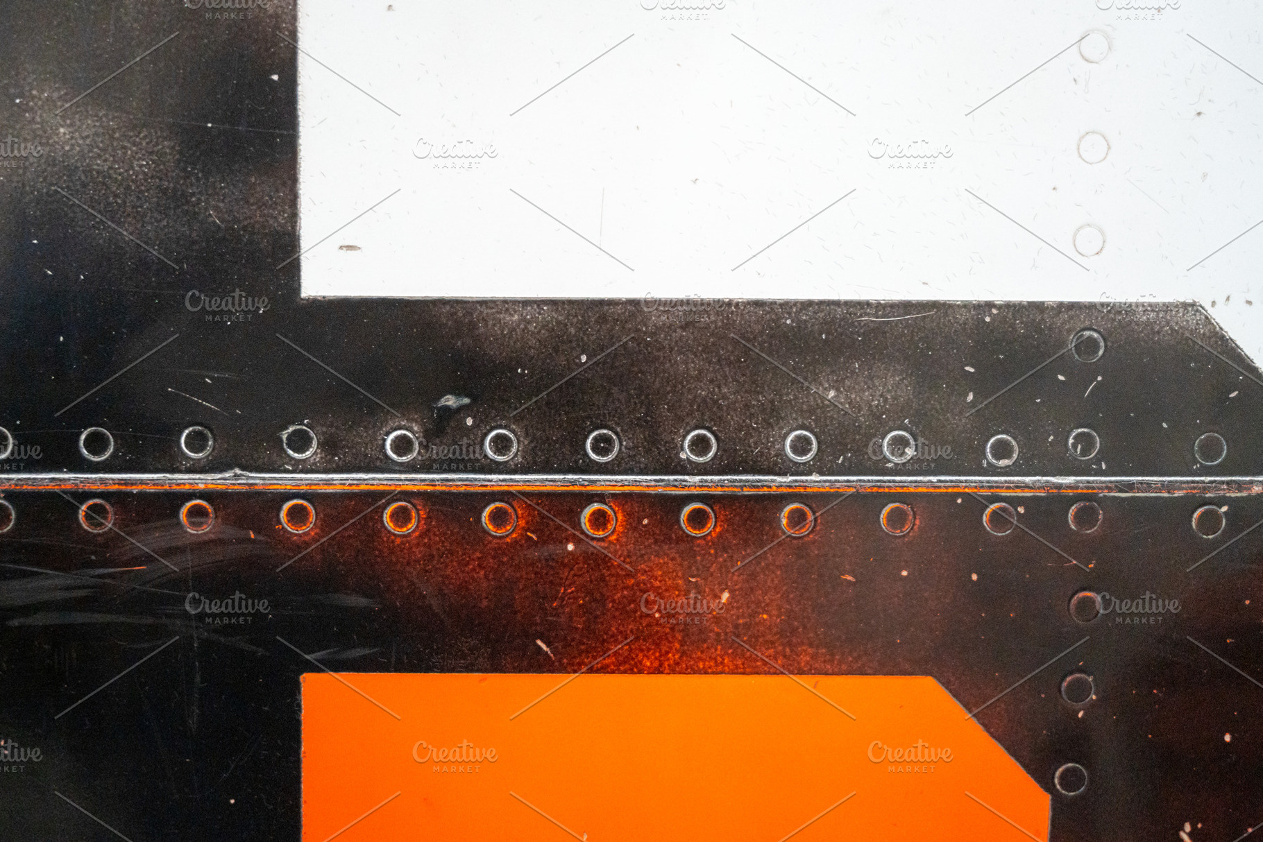 Close-up of riveted orange and white aircraft fuselage with glos, a Wallpaper Photo by GoodGoods