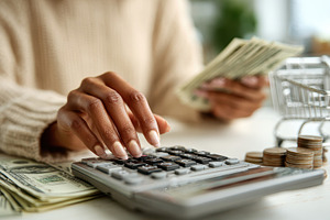 Woman Calculating Finances Money Bil, a Photo by Pixeness Studio