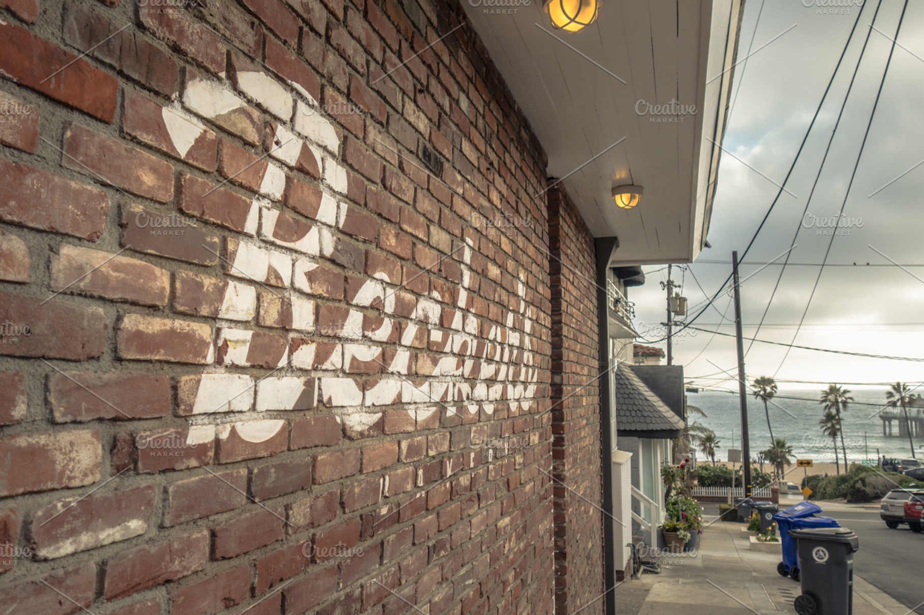 Painted Sign and Coast, an Architecture Photo by Catchline Studios
