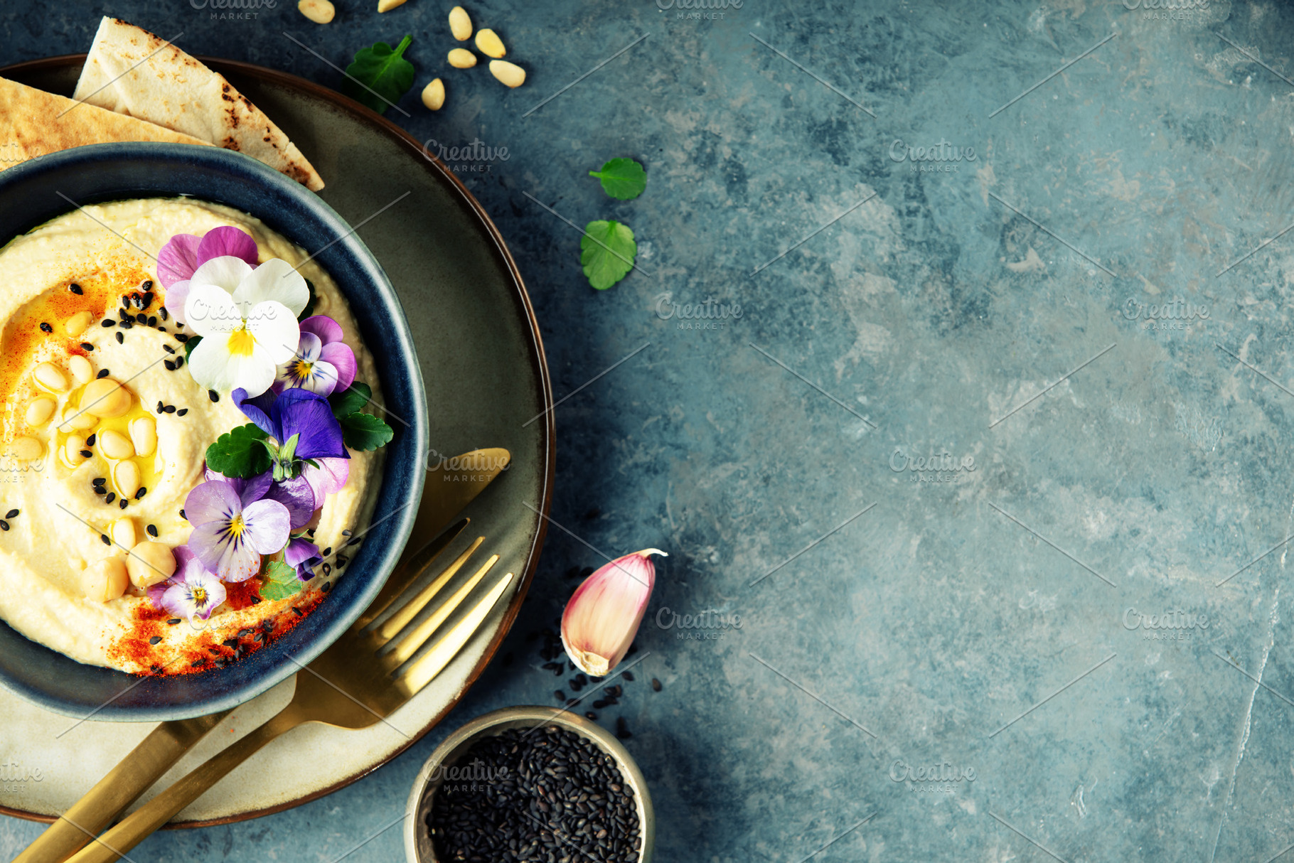 Gourmet Hummus with Edible Flowers and Pine Nuts on Blue Backgro, a Food & Drink Photo by Natalia Klenova's Shop