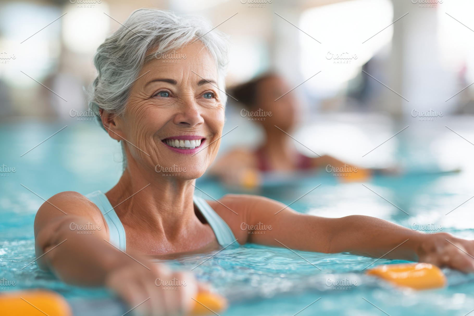 Smiling older woman enjoying water aerobics, a Sports & Recreation Photo by AlyaAnd