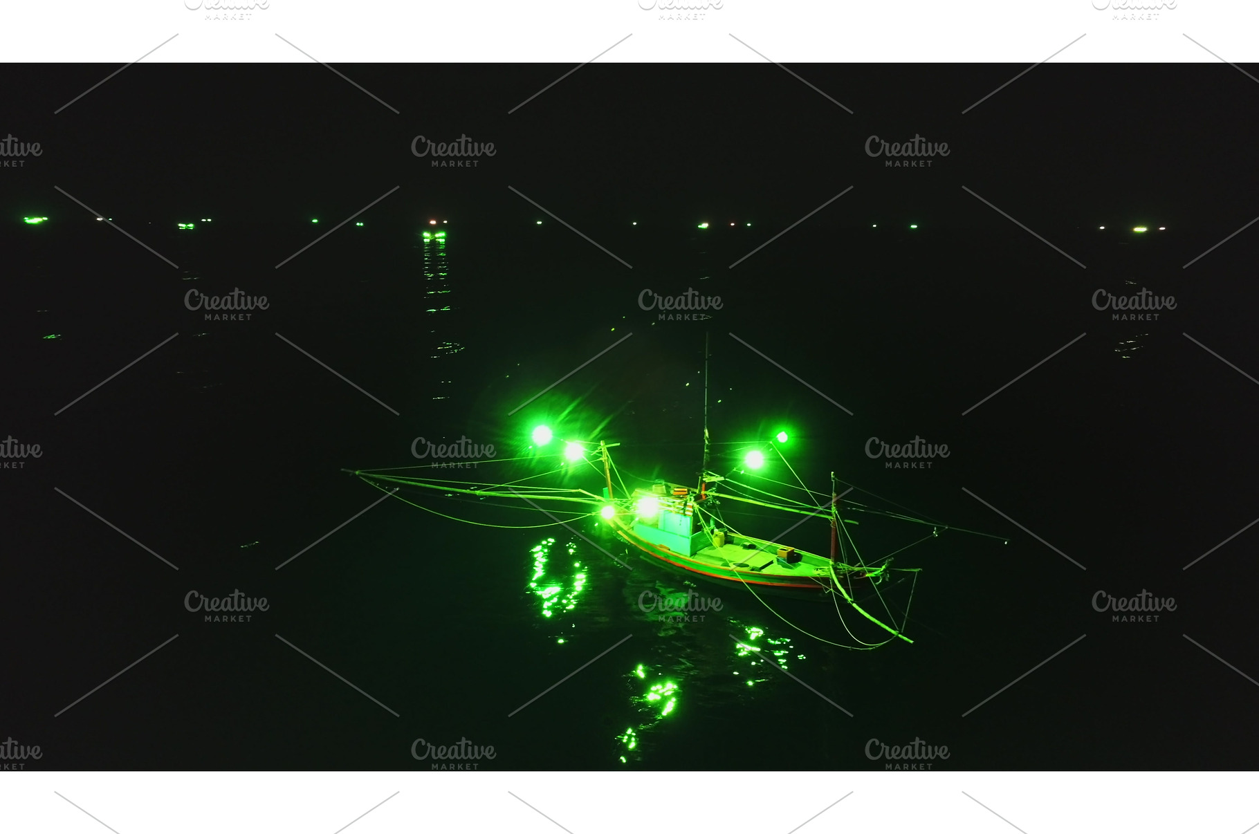 Fishing boat using green lights, a Transportation Photo by Goinyk