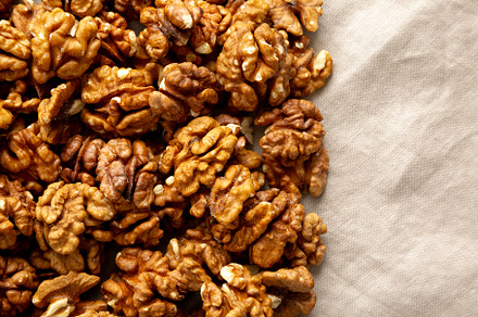 Raw Walnut Halfs, top view. Flat lay, overhead. Copy space.