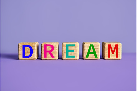 The word DREAM on wooden blocks over