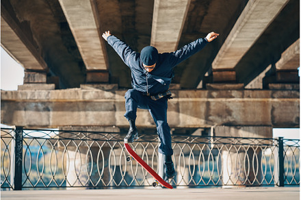 Skateboarder doing a trick on the, a Person Photo by Gladkov photography