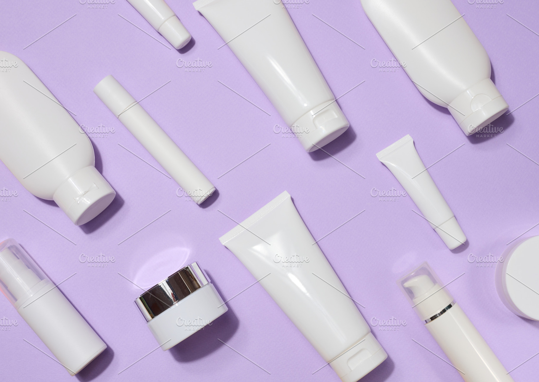 A variety of white plastic tubes and bottles with cosmetics arra, a Beauty & Fashion Photo by ndanko