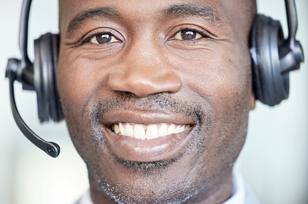 Call center, face and smile with portrait of businessman for telemarketing, consulting and customer support. Ecommerce, telecom and microphone with black man for crm, help desk and contact us service, a Photo by Peopleimages.com