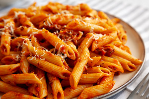 Homemade Pasta Bolognese with Cheese on a Plate, side view. Clos, a Food & Drink Photo by LiudmylaChuhunova