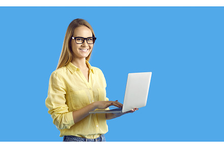 Smiling woman work online on, a Technology Photo by StudioRomantic