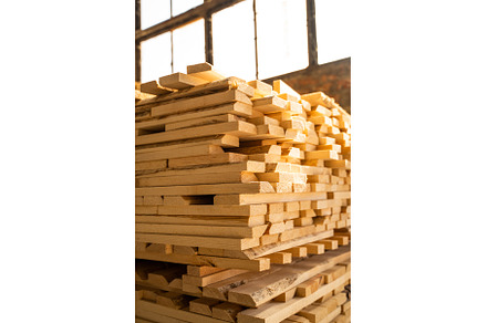 Stacked wooden planks in close-up at, an Industrial Photo by volodymyrshtun13795