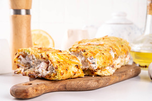 Zucchini roll stuffed with cream cheese or yogurt with tomatoes, a Photo by Rimma
