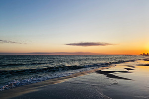 Sunset over a calm Florida Pensacola beach with gentle waves and orange sky alo, a Nature Photo by AS photostudio