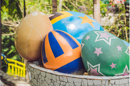 Multicolored eggs in the grass, a Holiday Photo by Elizaveta Galitskaya